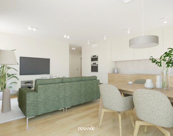 Przytulny salon w jasnych kolorach z okrągłym stolikiem kawowym i zielonym narożnikiem.